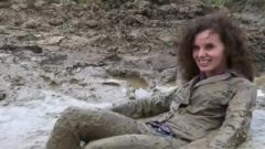 Chick Persuaded To Bathe Totally Clothed In Mud